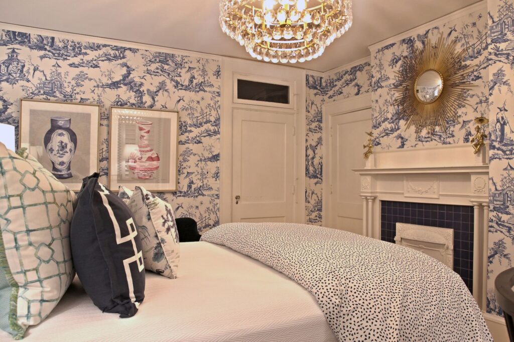 Preppy Guest Suite Bedroom with Fireplace