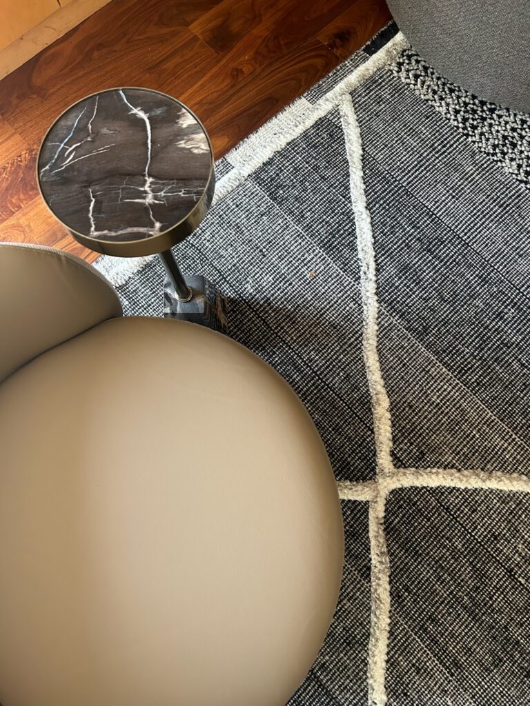 modern form area rug and end table